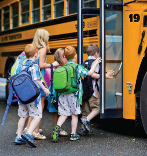 Kids board school bus